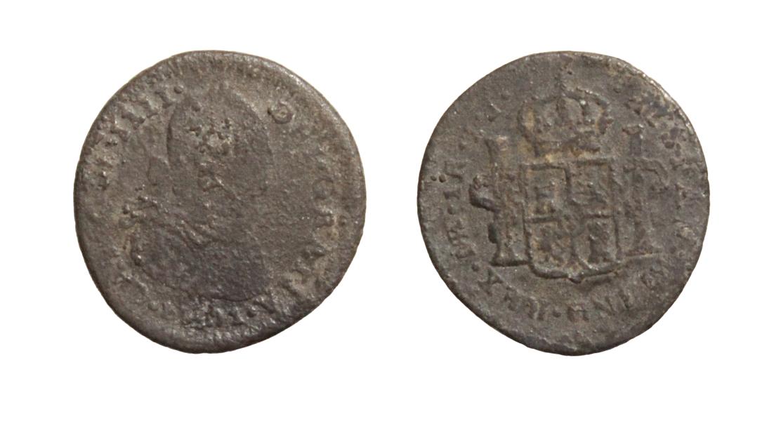 Pieza cubierta por una pátina gris oscura