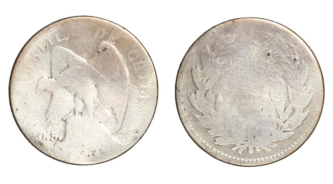 Pieza de forma circular, color plateado con óxido en algunos sectores